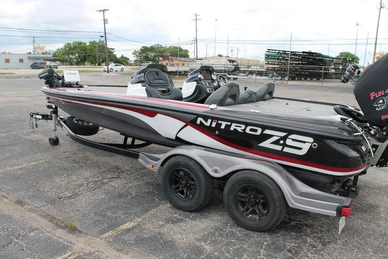 Slide: The Image of 2012 Nitro Z-9 boat on trailer, parked in a lot, side view. - 5