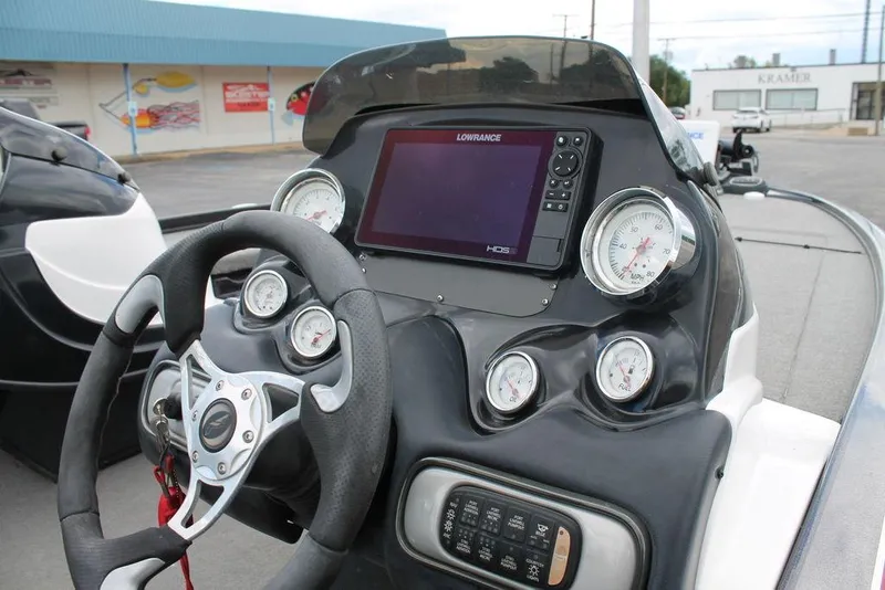 Slide: The Image of 2012 Nitro Z-9 boat dashboard with steering wheel, gauges, and Lowrance HDS display. - 6