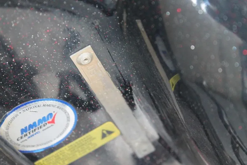 Slide: The Image of Close-up of a 2012 Nitro Z-9 boat hull with certification sticker and metal strip. - 8