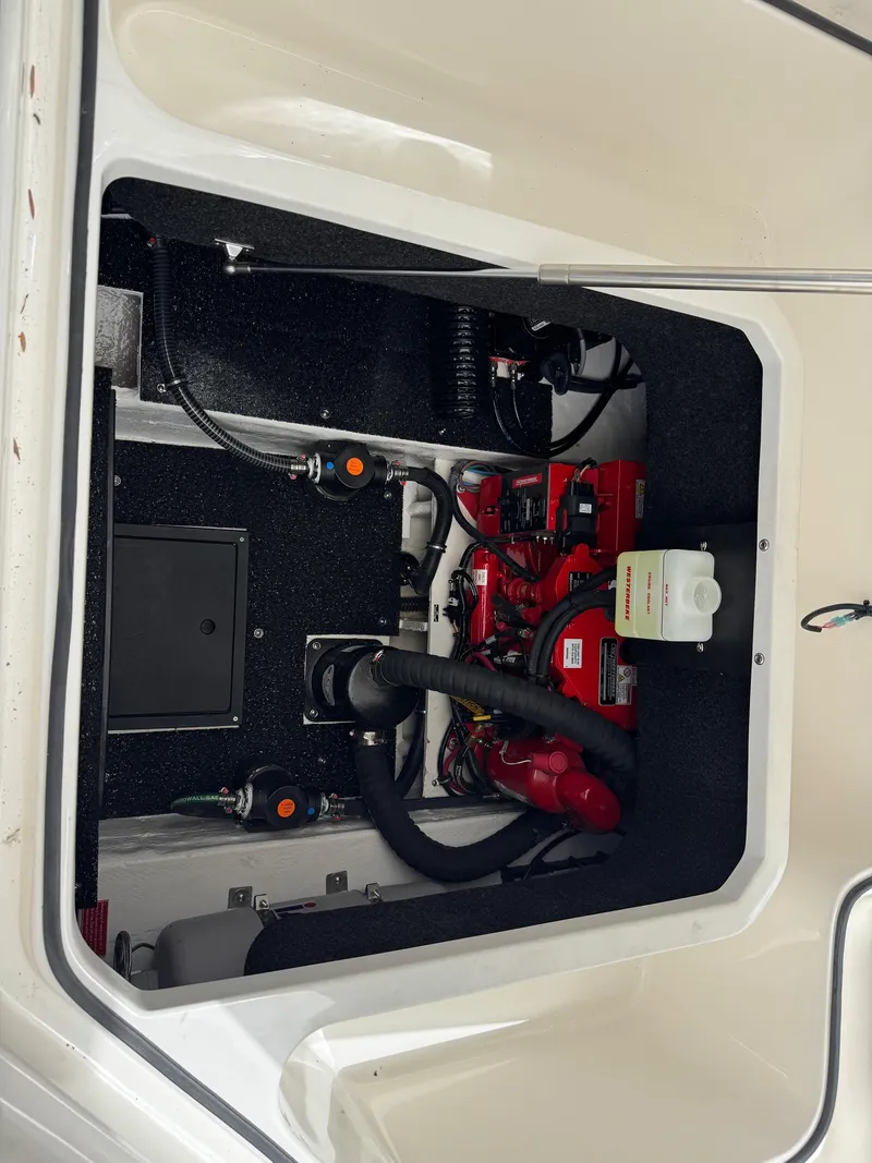 Slide: The Image of Engine compartment of 2025 Regal 26 XO boat, showcasing mechanical components and systems. - 16