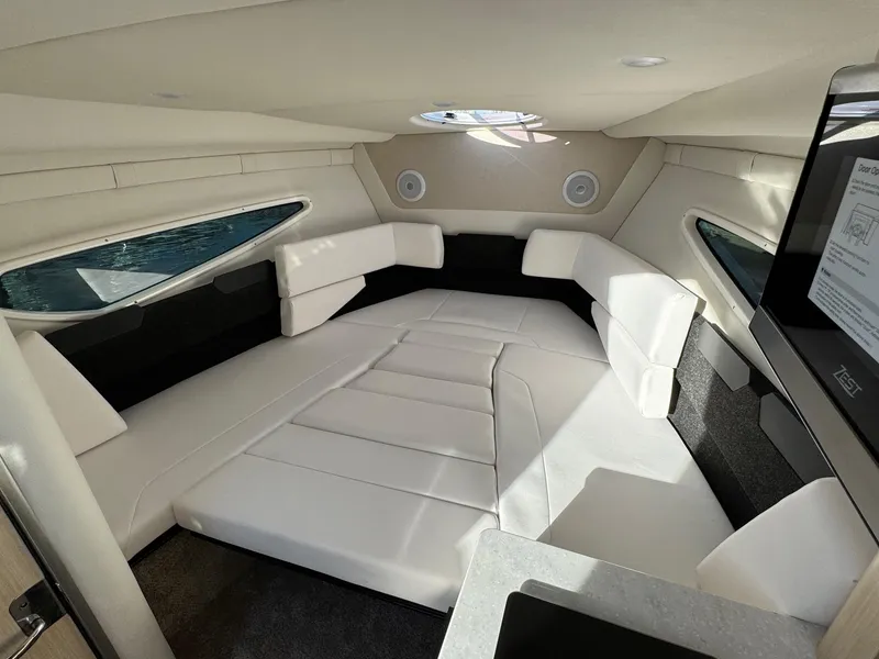Slide: The Image of 2025 Regal 26 XO boat interior with white seating and modern design. - 45