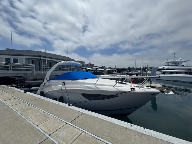 Slide: The Image of 2025 Regal 26 XO boat docked at marina under cloudy sky. - 69