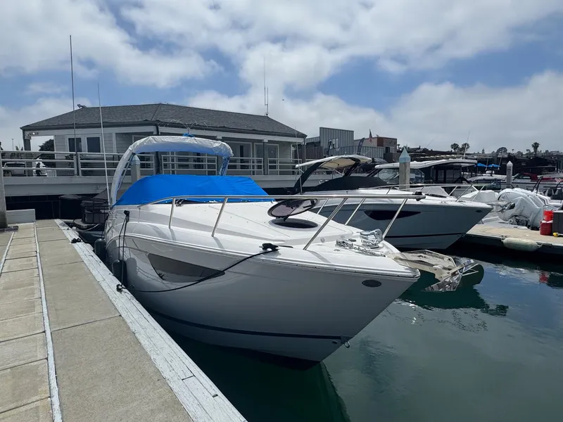 Slide: The Image of 2025 Regal 26 XO boat docked at marina under cloudy sky. - 70