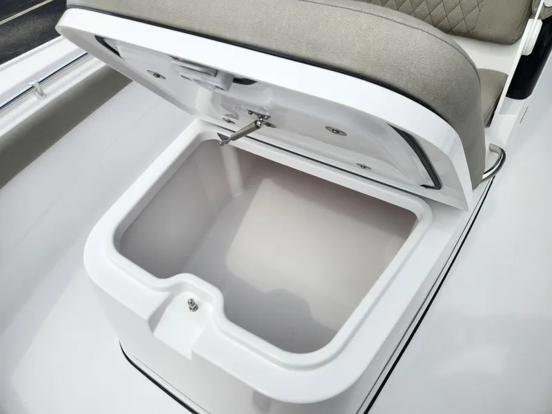 Slide: The Image of Open storage compartment on 2025 Sportsman Masters 247OE Bay Boat. - 10