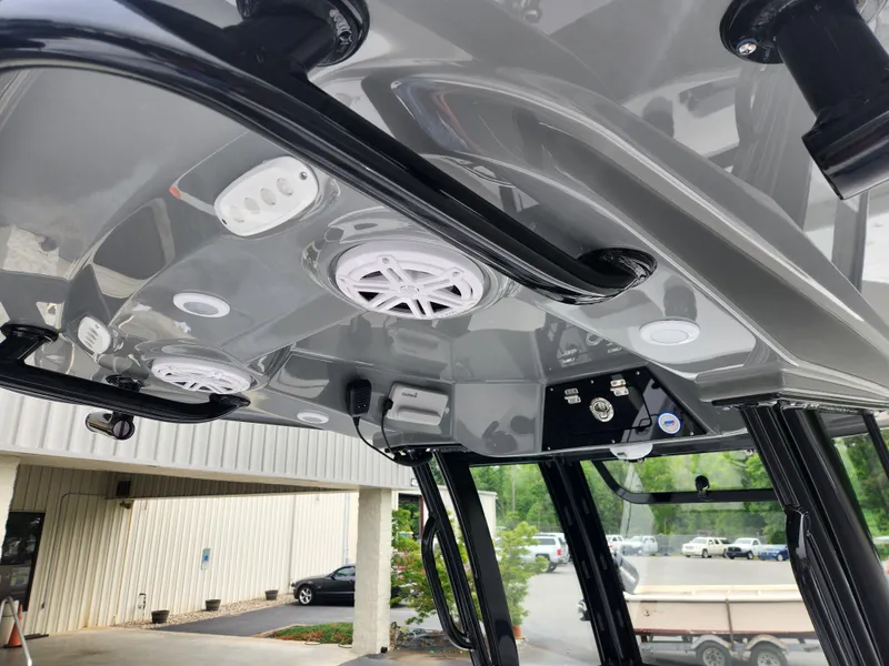 Slide: The Image of 2025 Sportsman Masters 247OE Bay Boat interior ceiling with speakers and lights. - 21