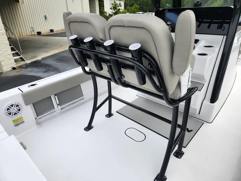 Slide: The Image of 2025 Sportsman Masters 247OE Bay Boat interior with dual seats and rod holders. - 23