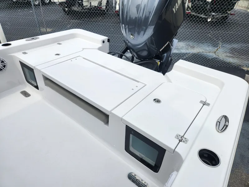 Slide: The Image of 2025 Sportsman Masters 247OE Bay Boat with Yamaha engine, featuring spacious deck and storage compartments. - 24