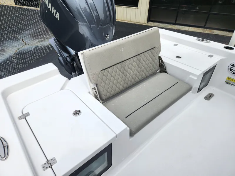 Slide: The Image of 2025 Sportsman Masters 247OE Bay Boat with Yamaha engine and cushioned seating. - 25