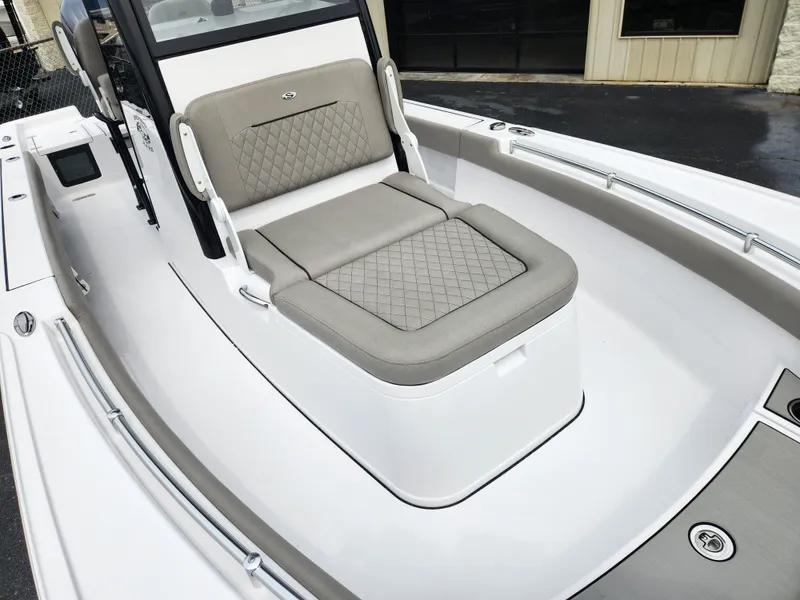 Slide: The Image of 2025 Sportsman Masters 247OE Bay Boat with cushioned seating and sleek design. - 8