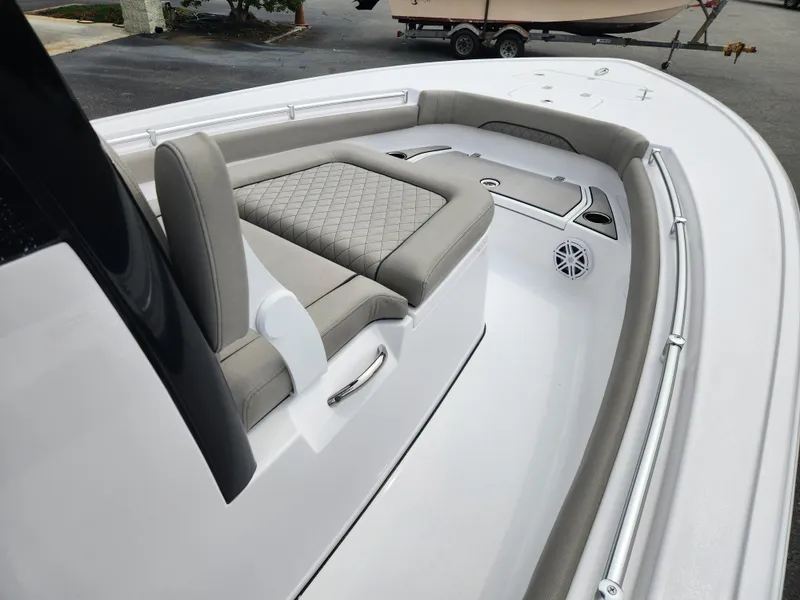 Slide: The Image of 2025 Sportsman Masters 247OE Bay Boat interior with cushioned seating and sleek design. - 9
