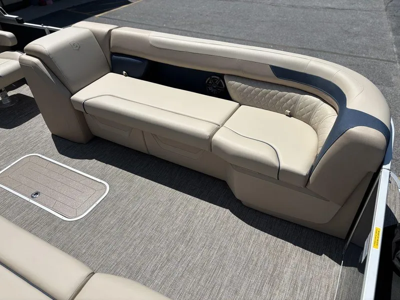 Slide: The Image of Luxurious seating on 2025 Godfrey SWEETWATER 2286 SB pontoon boat, featuring beige upholstery. - 11