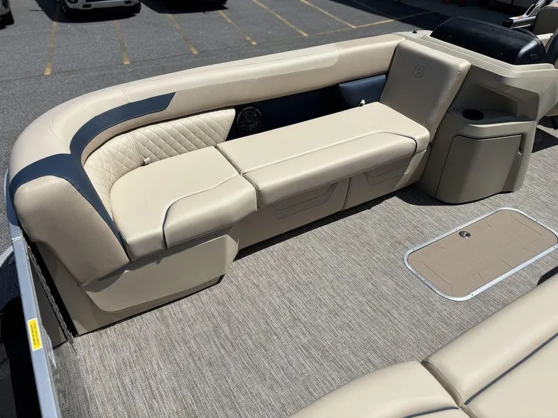 Slide: The Image of 2025 Godfrey SWEETWATER 2286 SB boat interior with beige seating and modern design. - 12