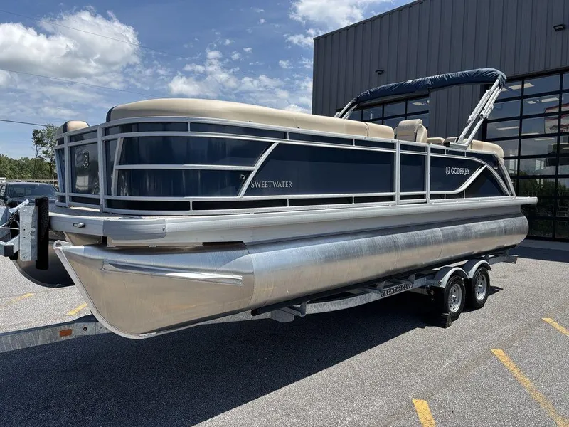 Slide: The Image of 2025 Godfrey SWEETWATER 2286 SB pontoon boat on trailer, parked outdoors. - 15
