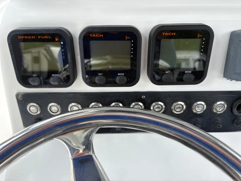 Slide: The Image of Dashboard of 2015 Cape Horn 27X3 boat with speed, fuel, and tachometer gauges. - 13