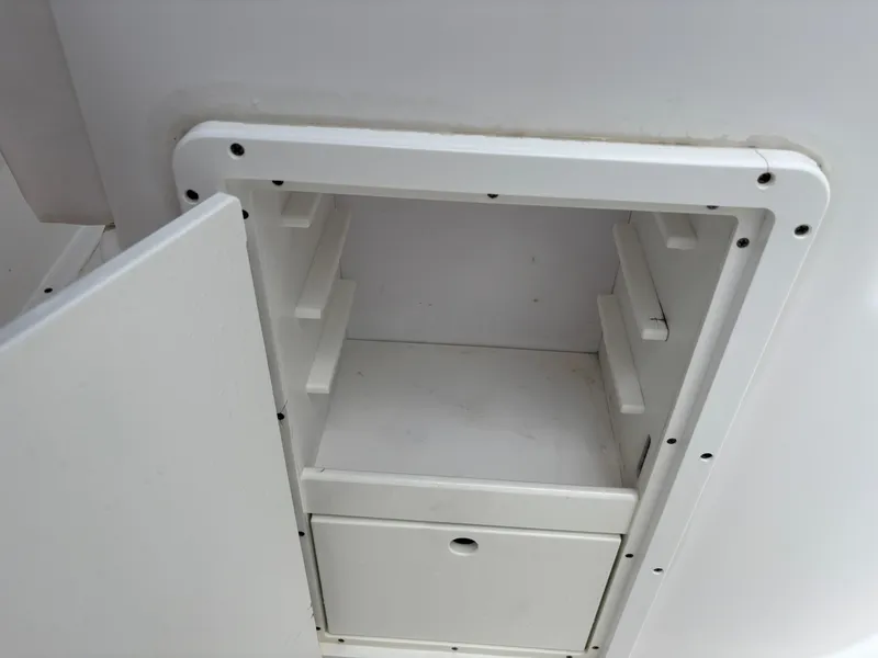Slide: The Image of Open storage compartment on a 2015 Cape Horn 27X3 boat. - 26