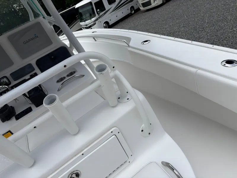 Slide: The Image of 2015 Cape Horn 27X3 boat interior with white seating and control panel. - 28
