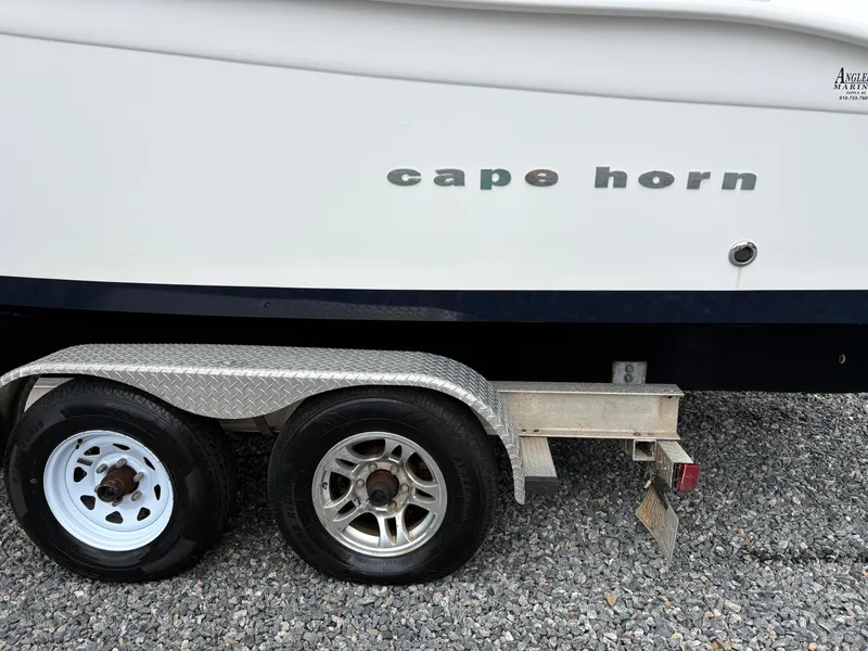Slide: The Image of 2015 Cape Horn 27X3 boat on trailer, side view with visible logo. - 4