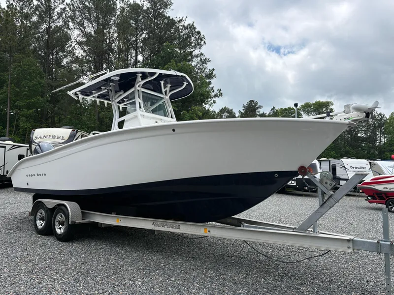 Slide: The Image of 2015 Cape Horn 27X3 boat on trailer, parked outdoors. - 7