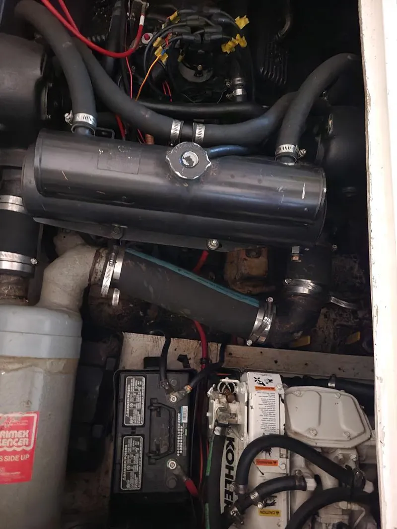 Slide: The Image of Engine compartment of a 1989 Bayliner 3255 Avanti boat, showing various components and wiring. - 20