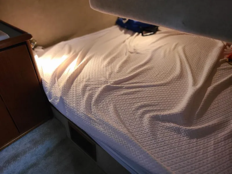 Slide: The Image of Cozy cabin bed in 1989 Bayliner 3255 Avanti boat interior. - 21