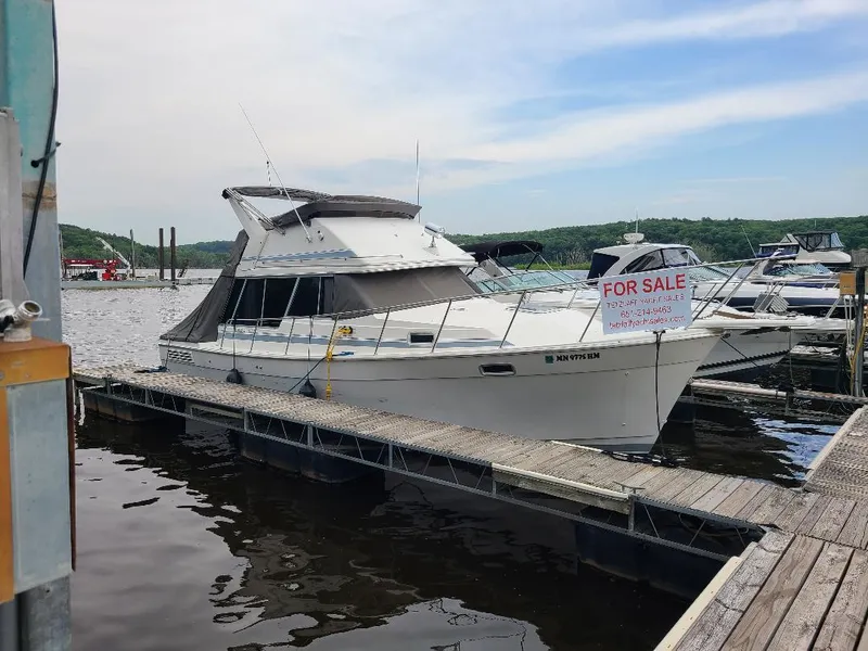 Slide: The Image of 1989 Bayliner 3255 Avanti boat docked, for sale sign visible. - 25