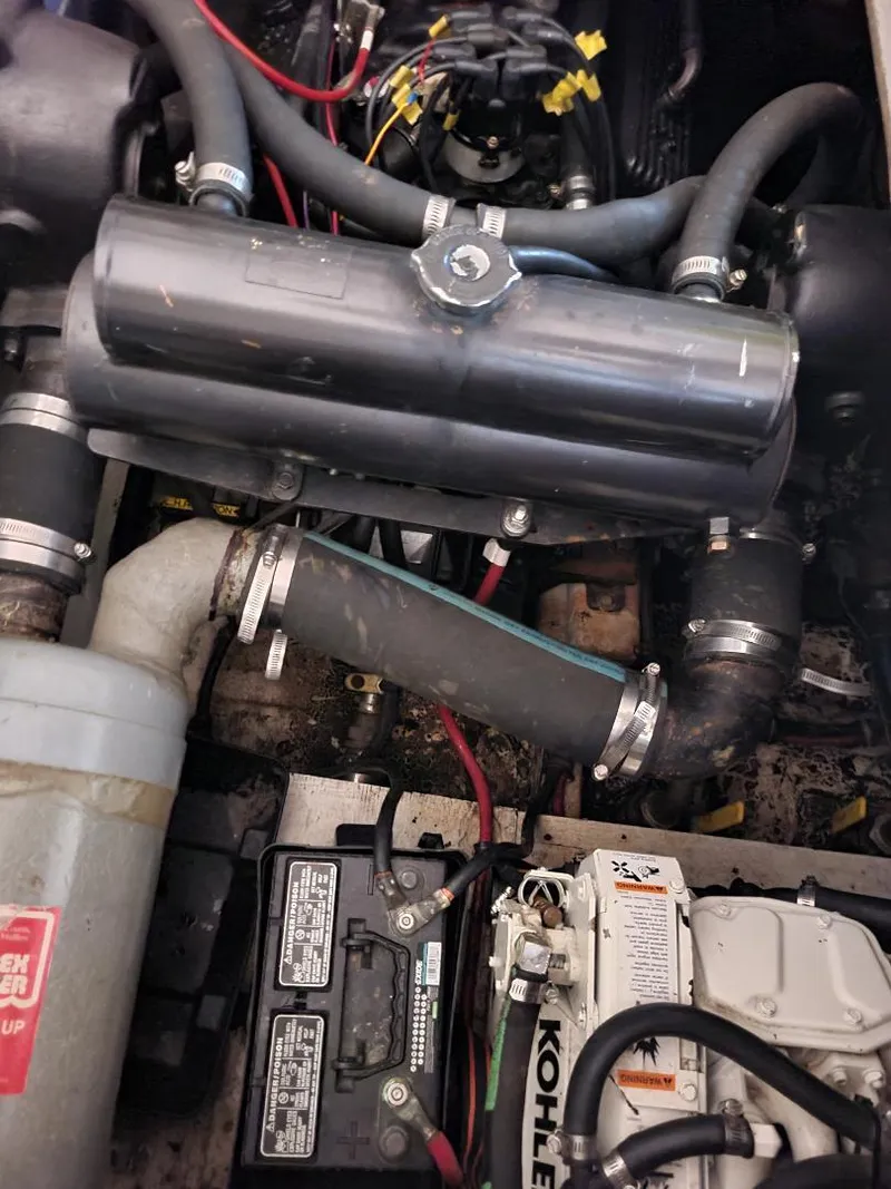 Slide: The Image of Engine compartment of a 1989 Bayliner 3255 Avanti with visible wiring and components. - 26