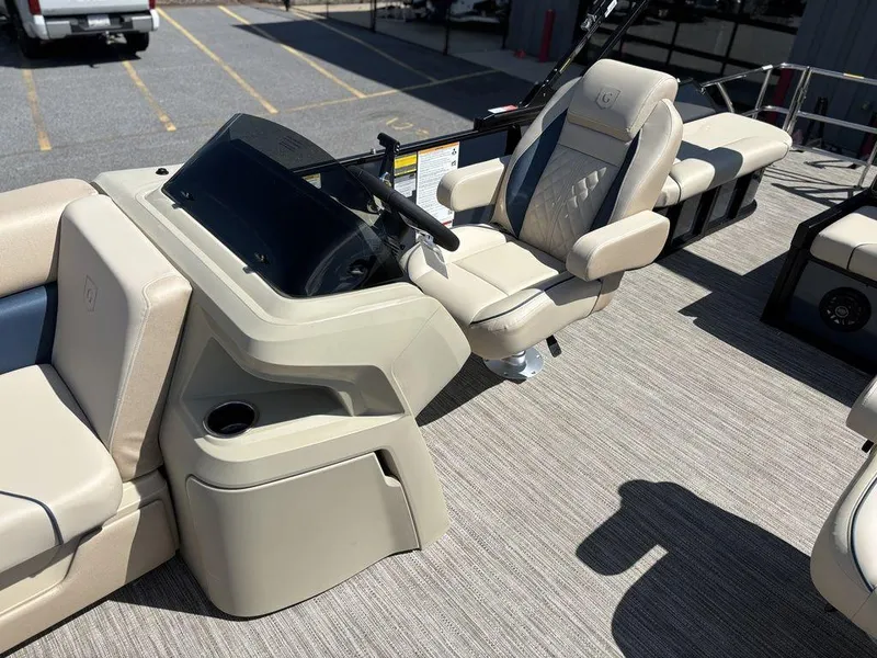 Slide: The Image of 2025 Godfrey Sweetwater 2486 SFLC boat interior with helm and seating area. - 10
