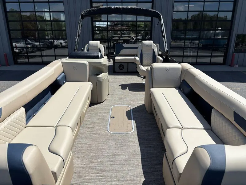 Slide: The Image of 2025 Godfrey Sweetwater 2486 SFLC pontoon boat interior with beige seating and modern design. - 16