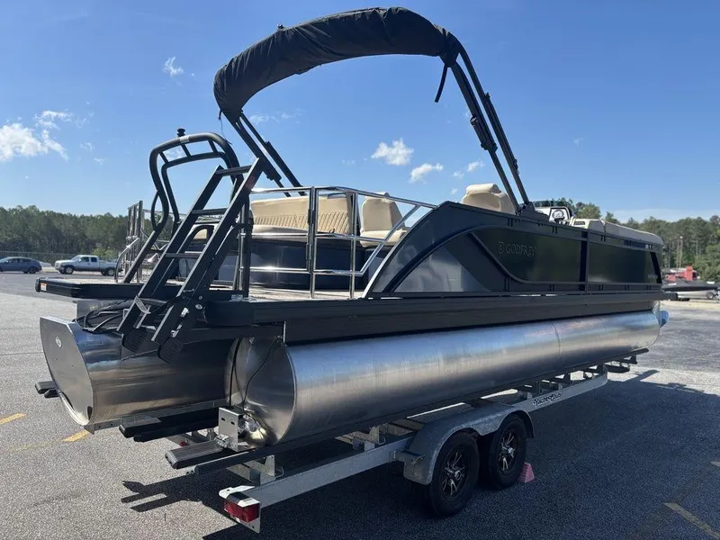 Slide: The Image of 2025 Godfrey Sweetwater 2486 SFLC pontoon boat on trailer, sunny day, outdoor setting. - 19