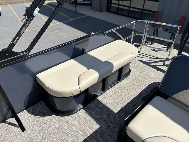 Slide: The Image of 2025 Godfrey Sweetwater 2486 SFLC boat interior with beige seating and sleek design. - 7