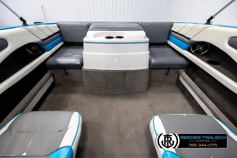 Slide: The Image of Interior of a 1993 Excel 20SX boat with gray and blue seating. - 19