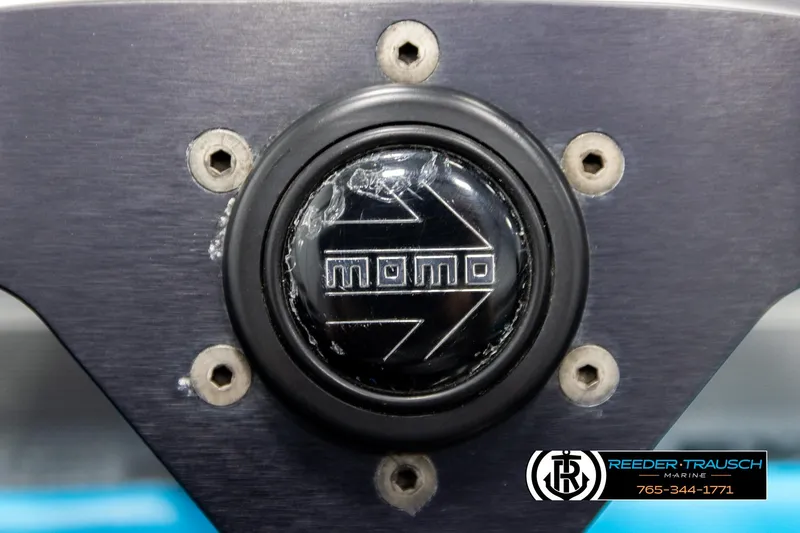 Slide: The Image of Steering wheel center with Momo logo on a 1993 Excel 20SX. - 25