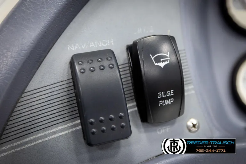 Slide: The Image of Control panel of a 1993 Excel 20SX boat with bilge pump switch. - 26