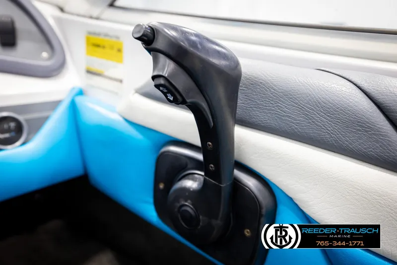 Slide: The Image of Control lever in a 1993 Excel 20SX boat interior, featuring blue and white upholstery. - 30