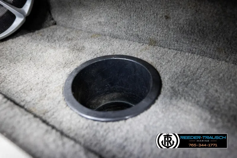 Slide: The Image of 1993 Excel 20SX boat interior with cup holder and speaker detail. - 37