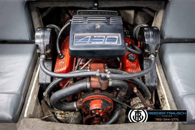 Slide: The Image of 1993 Excel 20SX boat engine, Volvo Penta, red and black components, Reeder-Trausch Marine logo. - 39