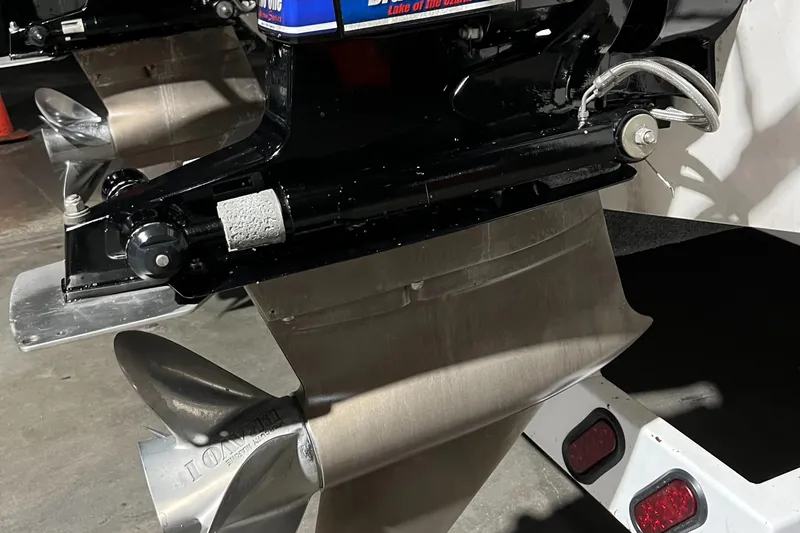 Slide: The Image of Propeller and outboard motor of a 2004 Spectre 36 Cat boat in a garage. - 22