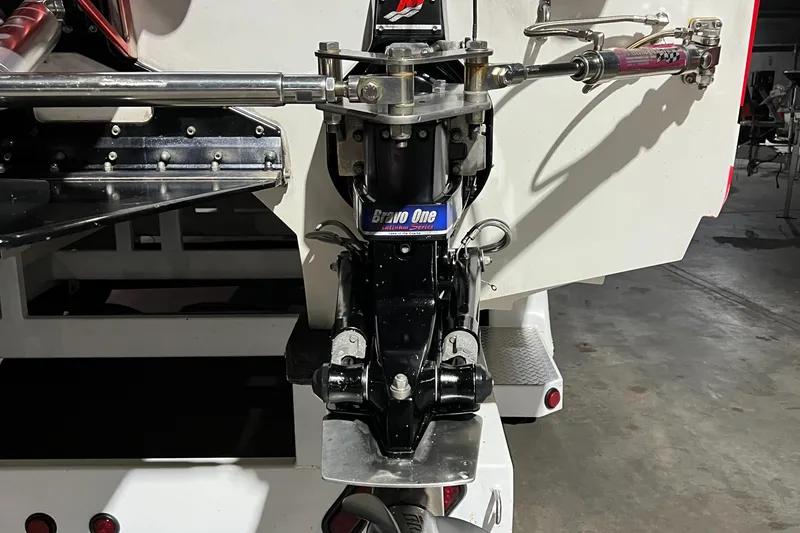 Slide: The Image of 2004 Spectre 36 Cat boat engine detail with Bravo One drive in a garage setting. - 23