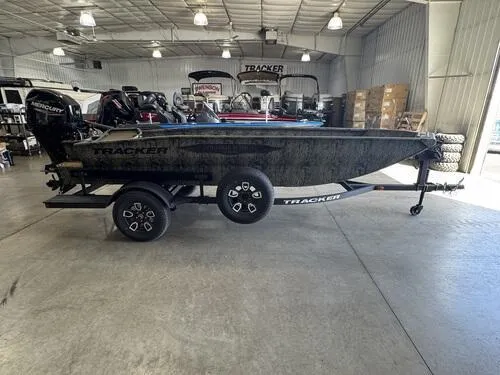 Slide: The Image of 2025 Tracker Grizzly 1650 T Prairie Wings Edition boat on trailer in showroom. - 3