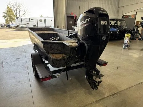 Slide: The Image of 2025 Tracker Grizzly 1650 T Prairie Wings Edition boat with Mercury 60 engine in showroom. - 4