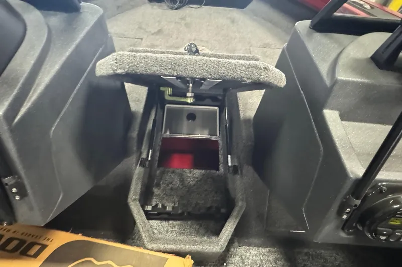 Slide: The Image of Interior view of 2025 Tracker Targa V-18 WT boat, featuring storage compartment. - 14
