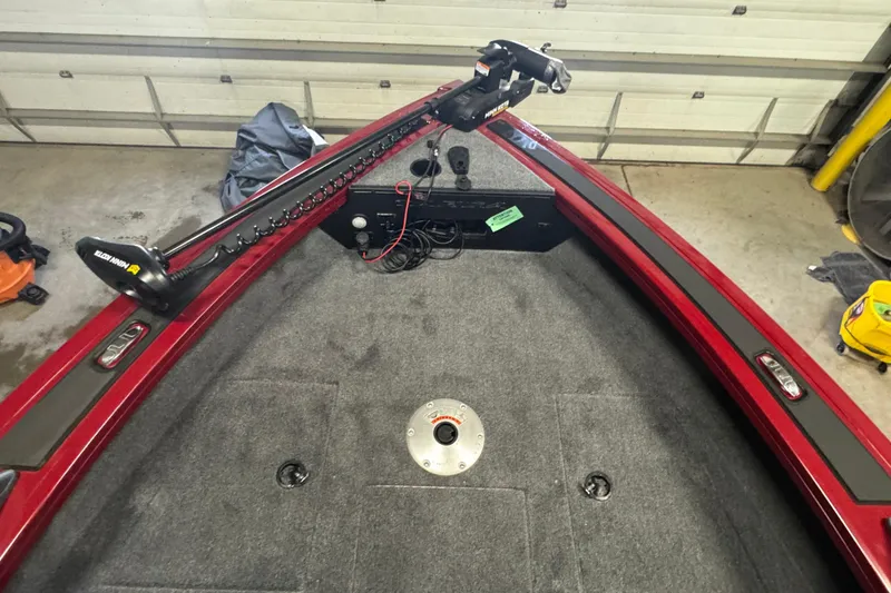 Slide: The Image of 2025 Tracker Targa V-18 WT boat interior with Minn Kota trolling motor in garage. - 15