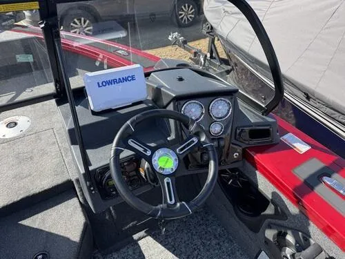 Slide: The Image of 2025 Tracker Targa V-18 WT boat dashboard with Lowrance navigation system and steering wheel. - 8