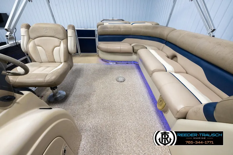 Slide: The Image of 2012 Cypress Cay 250 Cozumel boat interior with beige seating and blue accents. - 15
