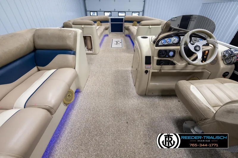Slide: The Image of 2012 Cypress Cay 250 Cozumel boat interior with plush seating and illuminated accents. - 17