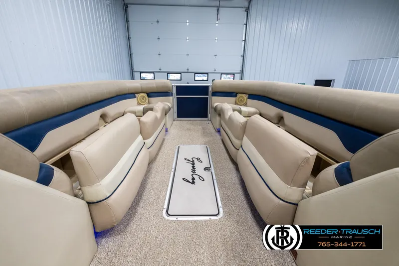 Slide: The Image of Interior of 2012 Cypress Cay 250 Cozumel boat with beige seating and carpet. - 20