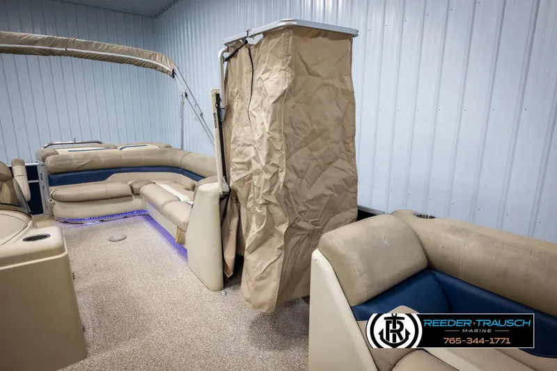 Slide: The Image of 2012 Cypress Cay 250 Cozumel pontoon boat interior with seating and privacy curtain. - 22