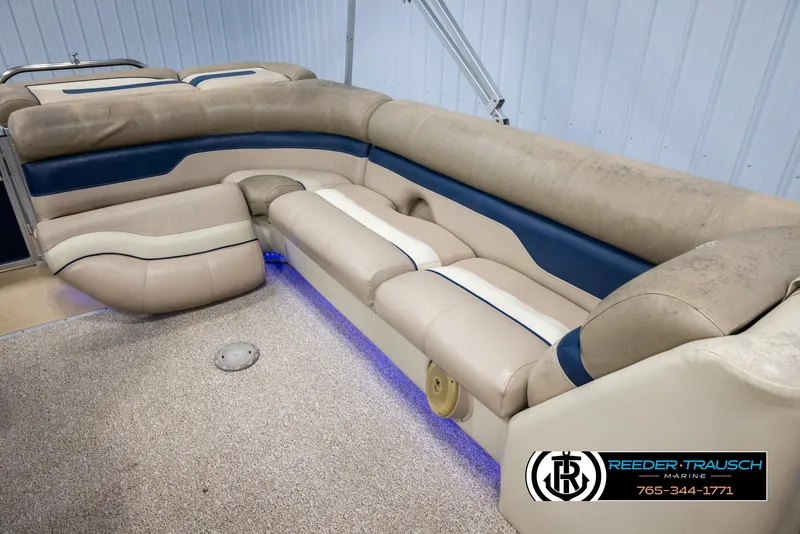 Slide: The Image of Luxurious seating on 2012 Cypress Cay 250 Cozumel pontoon boat with blue accent lighting. - 25