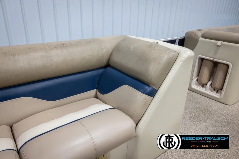 Slide: The Image of 2012 Cypress Cay 250 Cozumel boat seating with beige and blue upholstery. - 26