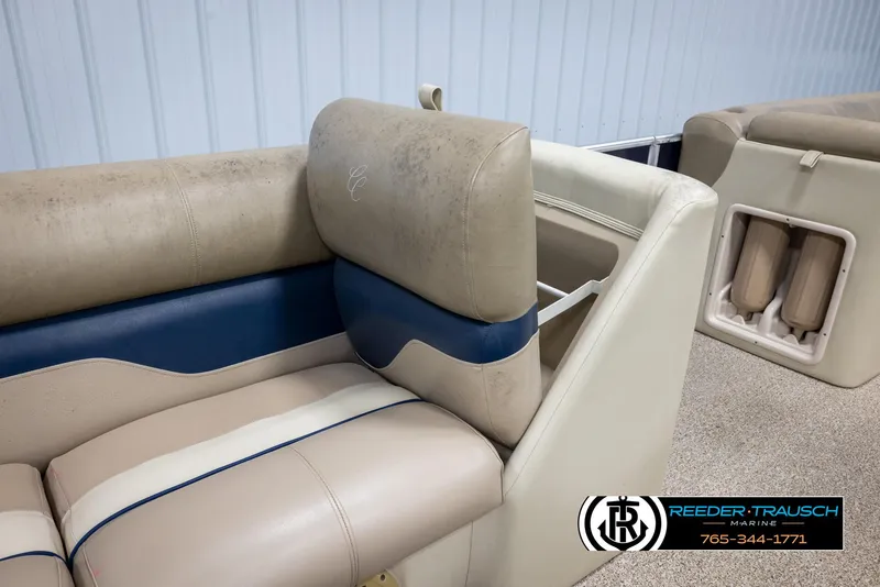 Slide: The Image of 2012 Cypress Cay 250 Cozumel boat interior with beige and blue seating. - 27